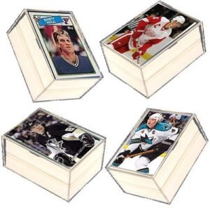 Four hockey trading cards in protective display cases
