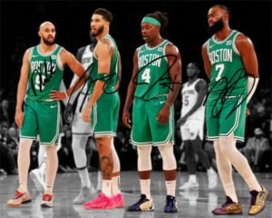 Four Boston Celtics basketball players in green jerseys, signed autographs