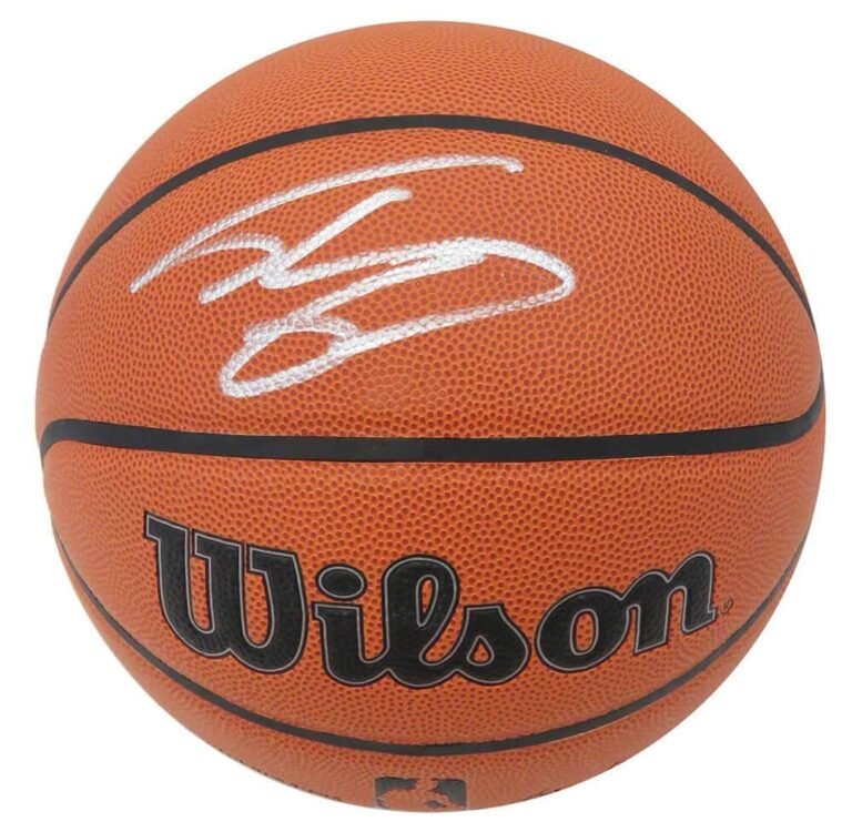Orange Wilson basketball with a white signature on it