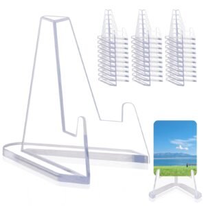 Clear plastic display stands, with stacks of smaller stands and a picture