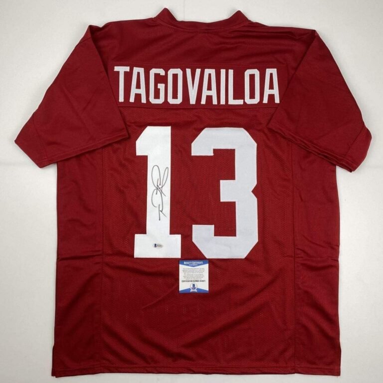 Red football jersey with "TAGOVAILOA" and number 13, signed