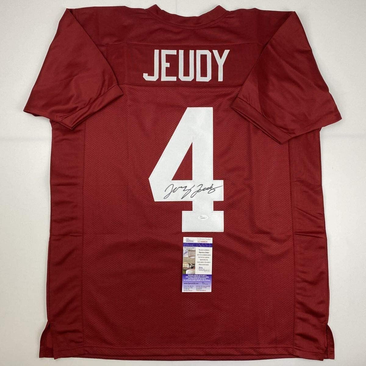 Red Jeudy football jersey with number 4, signature, and authentication tag