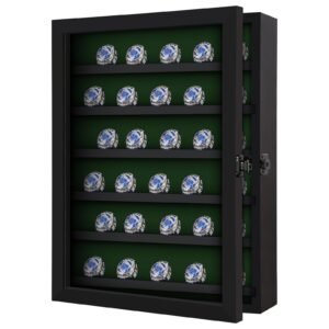 Display case with championship rings, black frame, green interior, open door