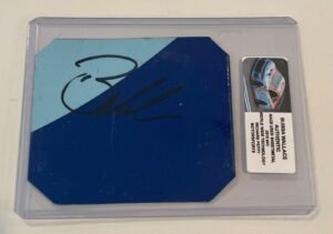 Bubba Wallace signed race-used sheet metal, in a protective case with a sticker