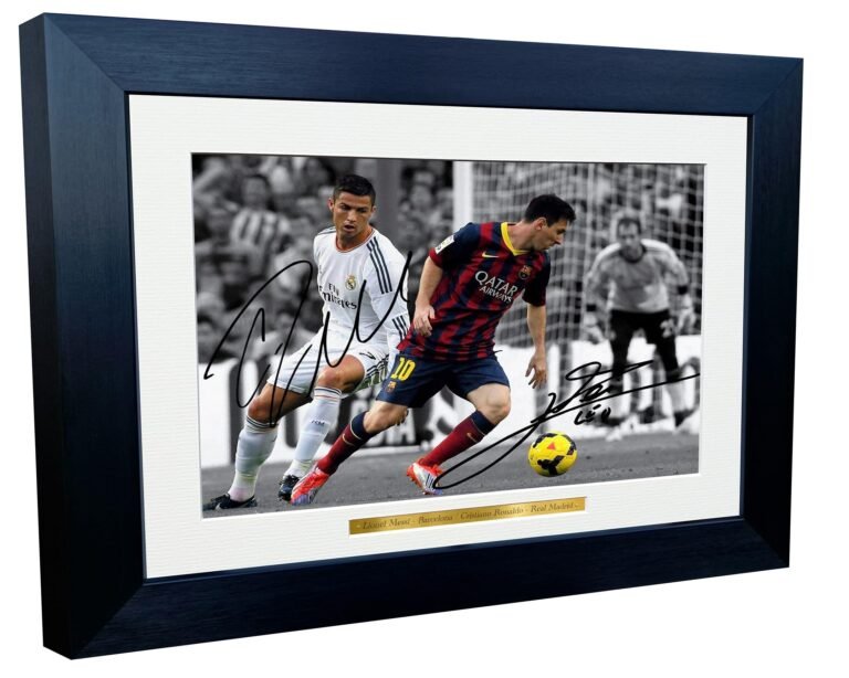 Framed photo of Lionel Messi and Cristiano Ronaldo playing soccer