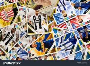 Pile of soccer player trading cards with various players and teams