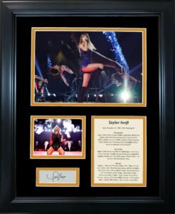 Framed Taylor Swift memorabilia with performance photos, signature, and discography